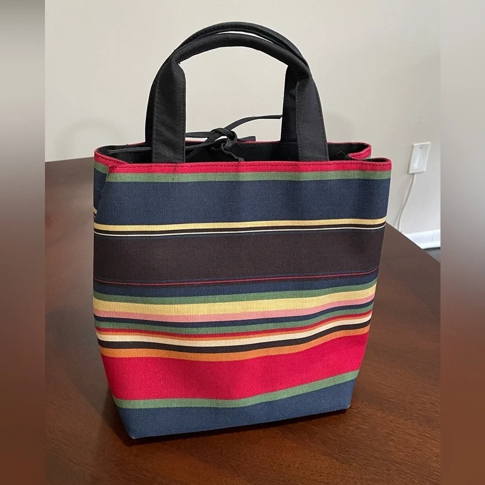 Kate Spade NY Vintage Caves tote bag multi color with leather tei closure.
